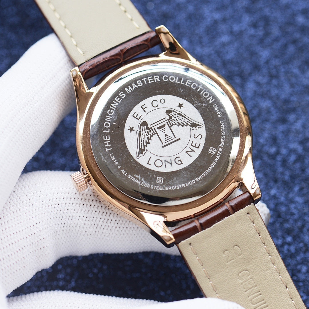 Gold-tone case wristwatch with brown leather strap and engraved case back.