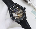 Longines analog watch with black dial, blue subdial, skeleton hands, black leather strap