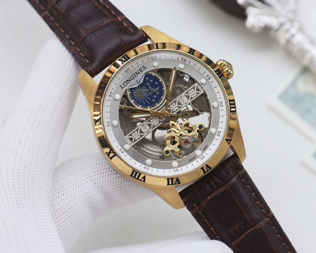 Gold-tone analog watch with black dial, blue subdial, skeleton details, brown leather strap