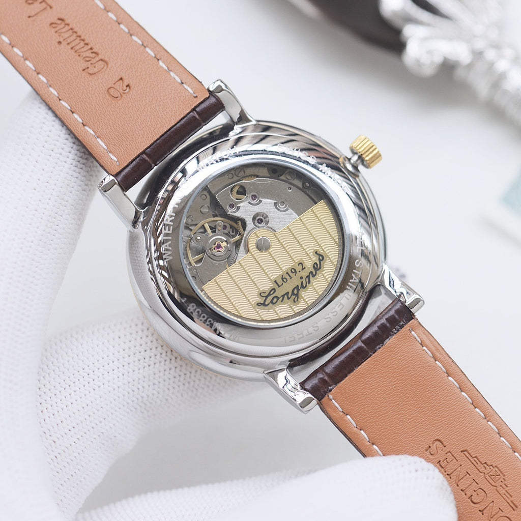 Longines automatic wristwatch, transparent caseback, brown leather strap, gold dial.