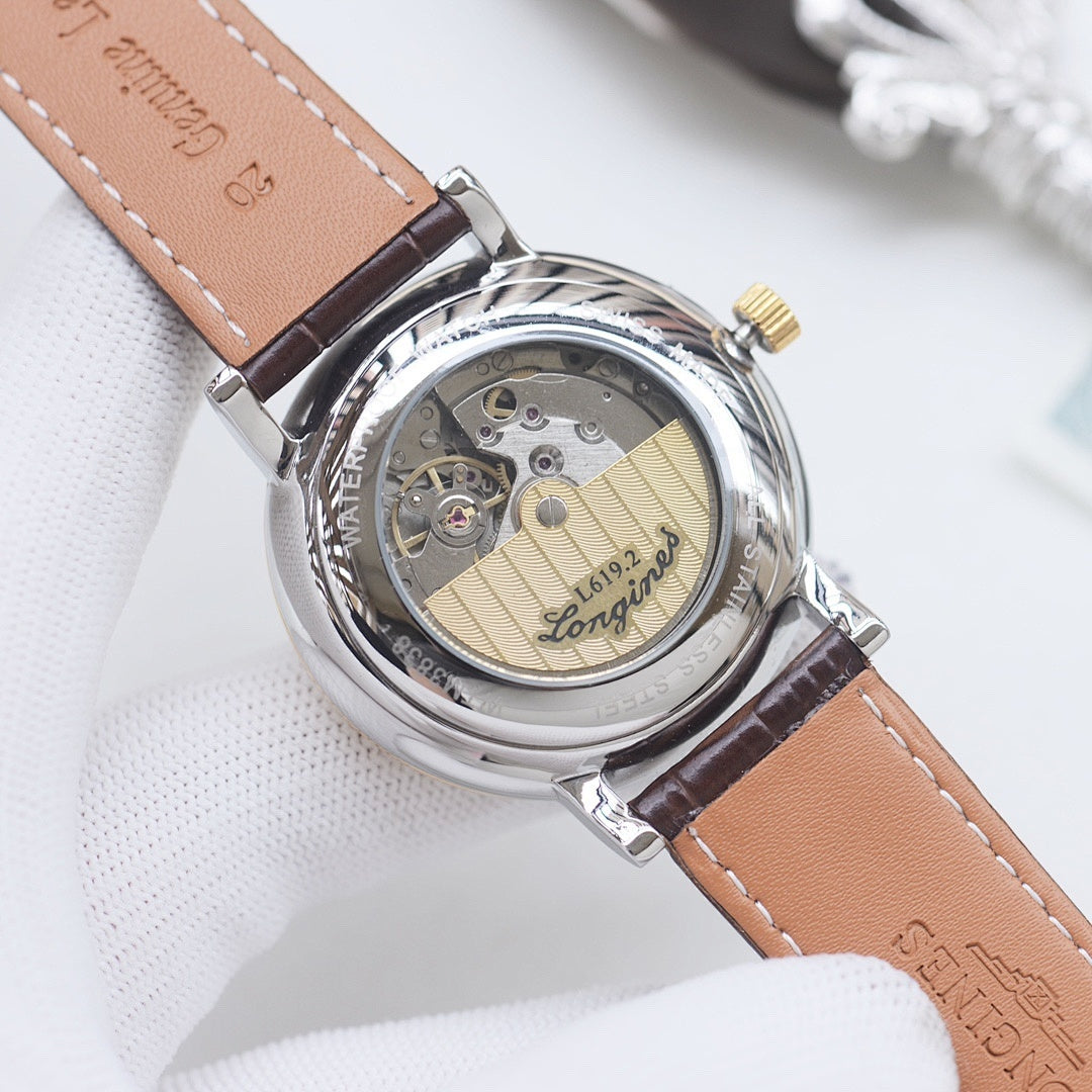 Longines automatic wristwatch, transparent caseback, brown leather strap, gold dial.