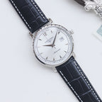 Longines automatic wristwatch, white dial, black leather strap, silver round case.