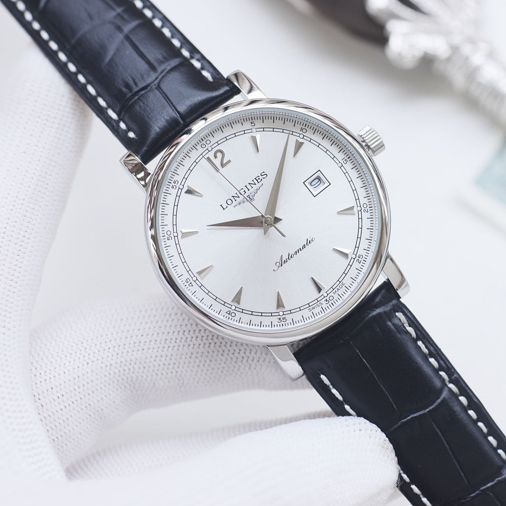 Longines automatic wristwatch, white dial, black leather strap, silver round case.