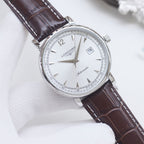 Longines automatic wristwatch, white dial, brown leather strap, silver round case.