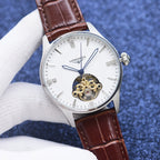 Longines watch with white dial, brown leather strap, gold skeleton movement, silver-tone case