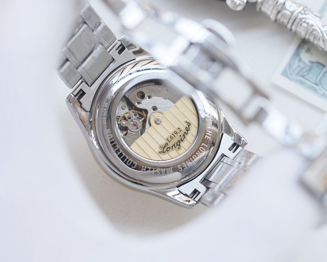 Longines watch back with see-through case showing mechanical movement