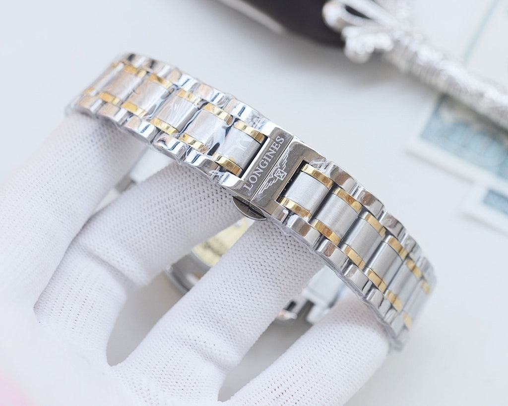 Longines bracelet links in silver and gold-tone, close-up on clasp