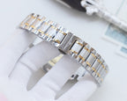 Longines bracelet links in silver and gold-tone, close-up on clasp