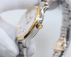 Longines watch case profile with gold-toned crown and silver bracelet links