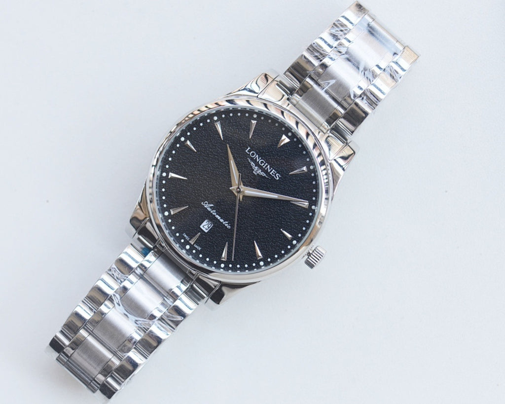 Longines watch with dark blue dial, silver metal bracelet and gold accents