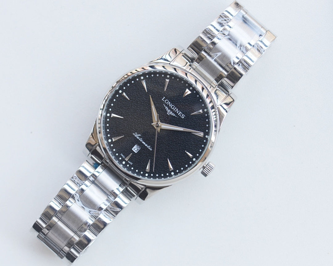 Longines watch with dark blue dial, silver metal bracelet and gold accents