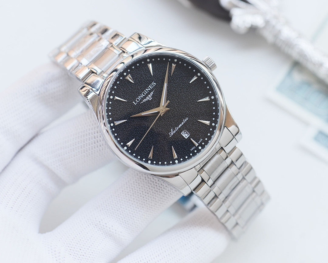 Longines two-tone watch with dark blue dial and gold hands on silver bracelet