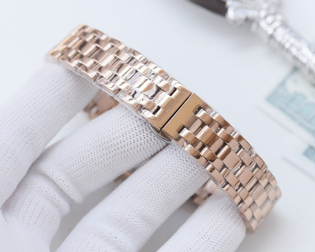 Longines watch with rose-gold metal link bracelet and rose-gold case, side crown detail