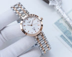 Longines watch with silver-and-gold tone metal bracelet and rose-gold bezel, white dial
