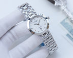 Longines watch with silver-toned case and metal link bracelet, white dial with three hands