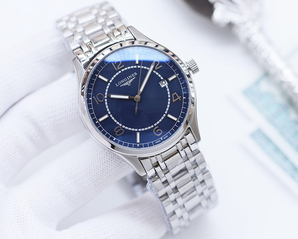 Longines watch with dark blue dial and silver metal bracelet.