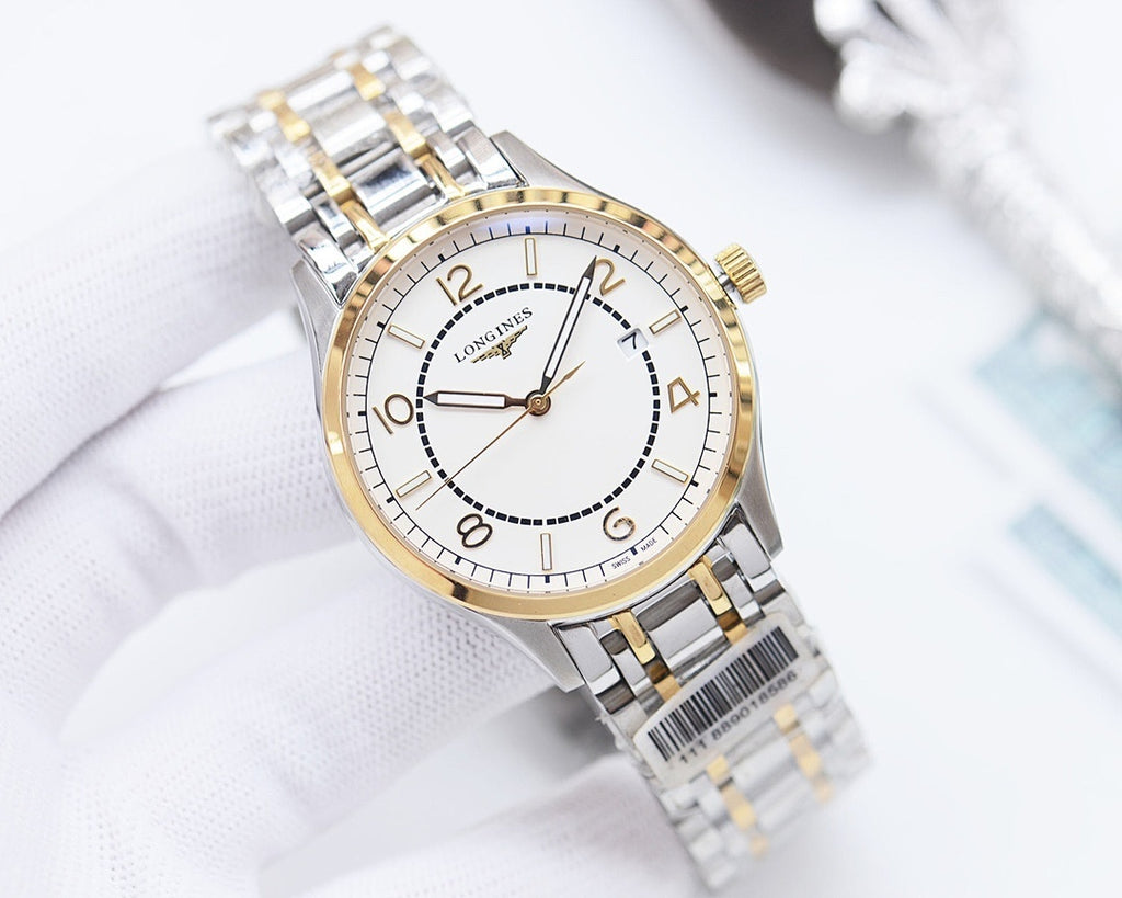 Longines watch with white dial, gold bezel ring, and two-tone metal bracelet.