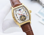 Gold-tone skeleton watch with brown leather strap, white dial with sub-dial window