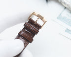 Longines leather watch strap with buckle and textured brown strap end