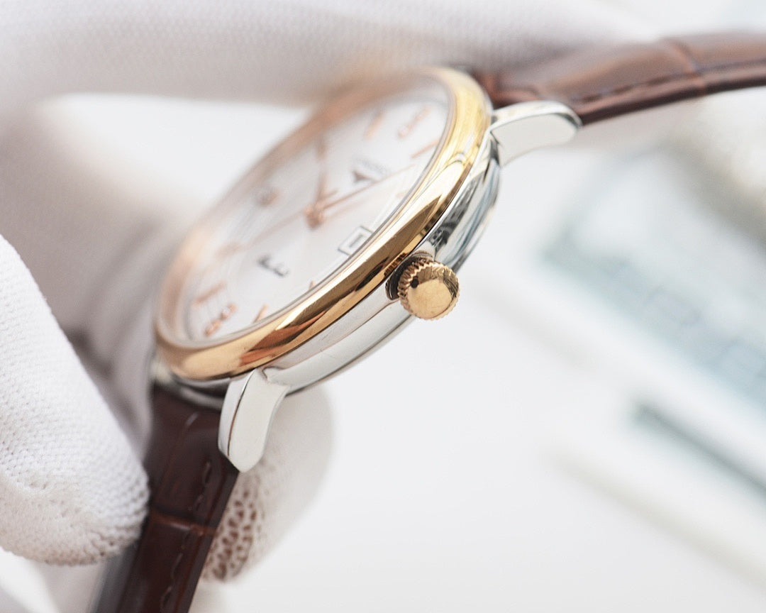 Gold-tone round watch with brown leather strap and crown detail