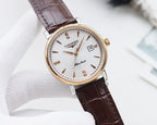 Round watch with gold-tone case, white dial, and brown leather strap