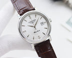Round watch with silver case, white dial, and brown leather strap