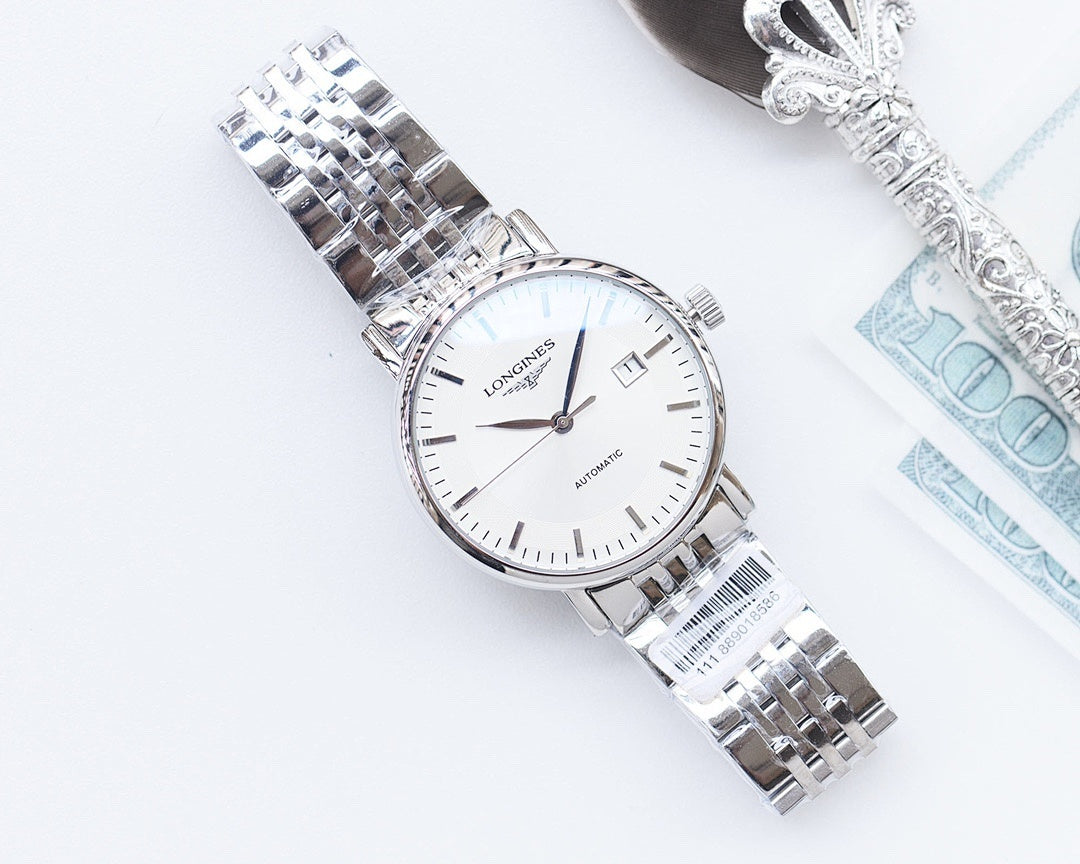 Longines automatic watch with white dial and silver bracelet, angled view