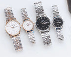 Longines watches on metal bracelets, white and dark dials, rose-gold accents, quartz