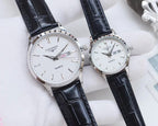 Longines watches with silver cases, white dials, black leather straps, quartz