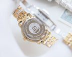 Longines two-tone stainless-steel watch showing engraved dial text and link bracelet