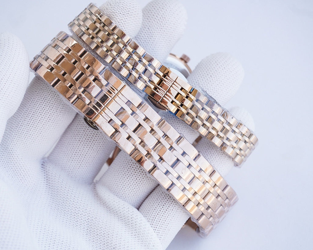 Two-tone metal link wristwatch bracelet with interwoven rose-gold and silver tones
