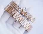 Two-tone metal link wristwatch bracelet with interwoven rose-gold and silver tones