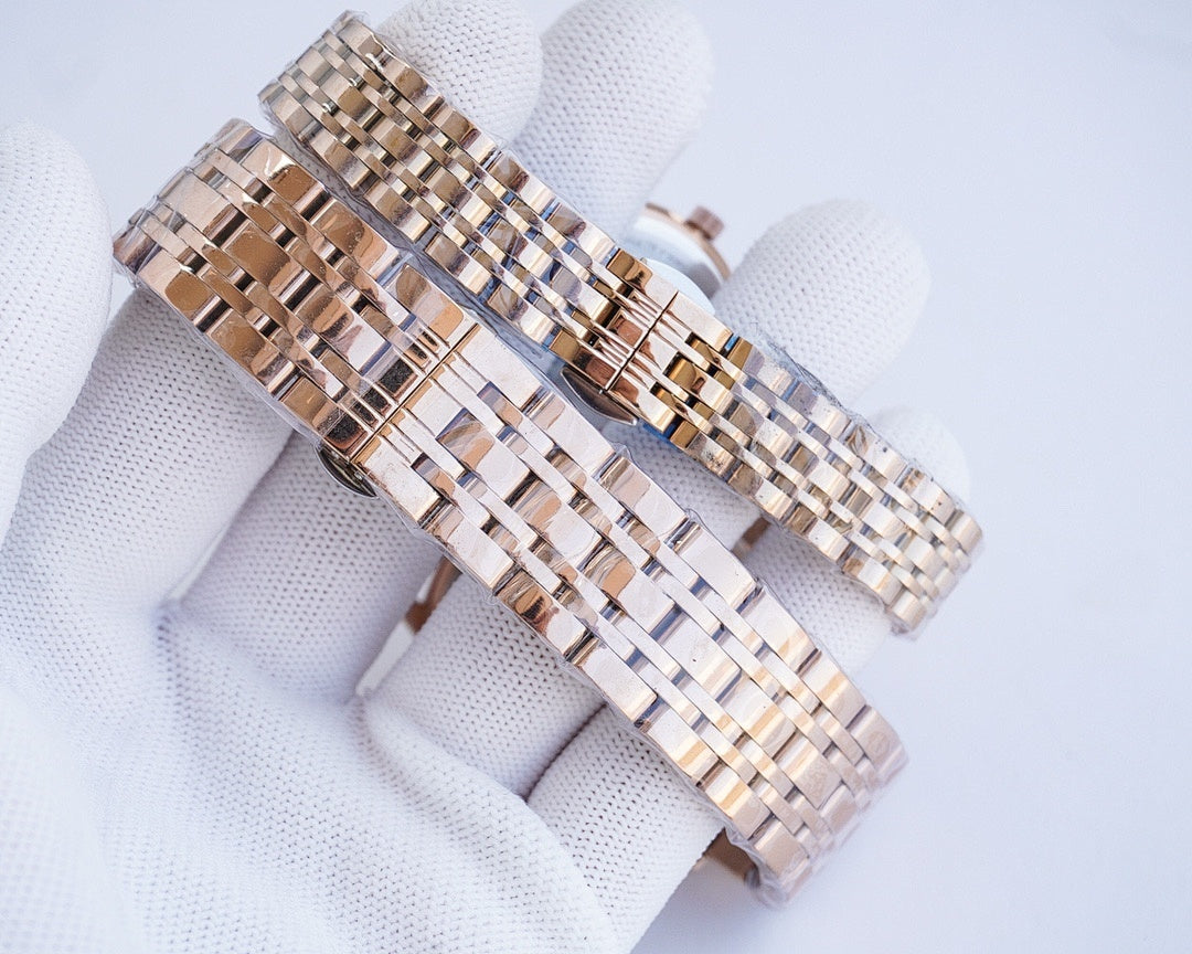 Two-tone metal link wristwatch bracelet with interwoven rose-gold and silver tones