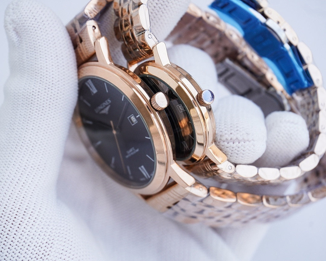 Rose-gold wristwatch with dark dial, metal link strap, and visible crown