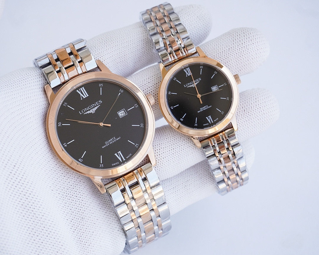 Two-tone wristwatch pair with dark dials, Roman numerals, and metal link bracelets