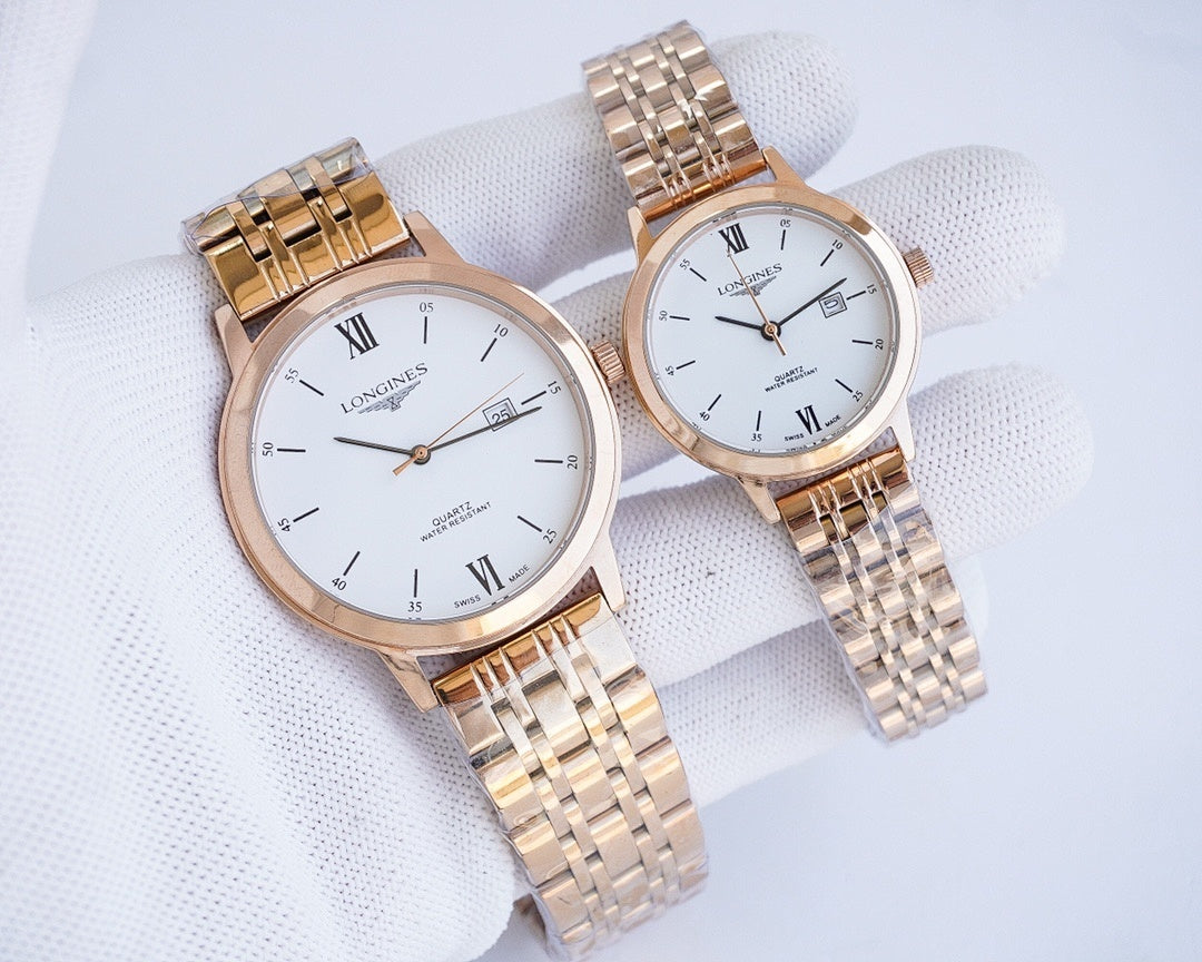Gold-tone two-tone wristwatch pair with white dials and Roman numerals on metal links