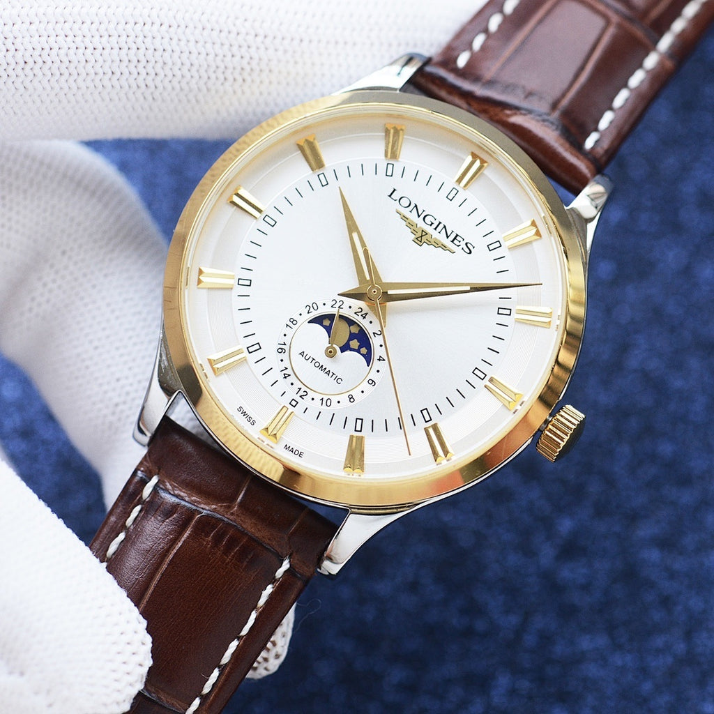 Longines watch with gold case, white dial, brown leather strap, and moonphase subdial.