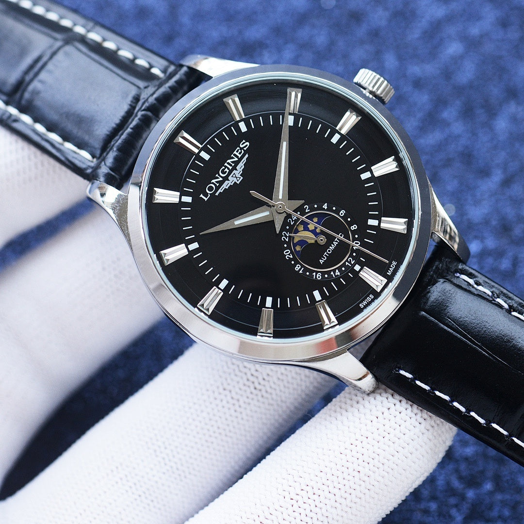 Longines watch with black dial, silver case, black leather strap, and moonphase window.