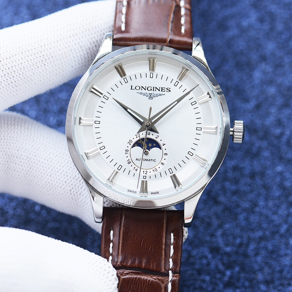 Longines watch with silver case, white dial, and brown leather strap with stitch detail.