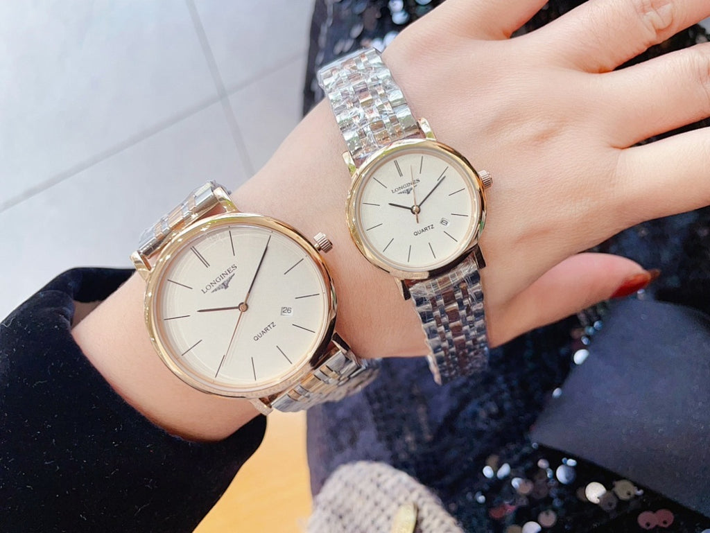 Two Longines quartz watches with silver link bracelets, white dials, rose-gold style cases
