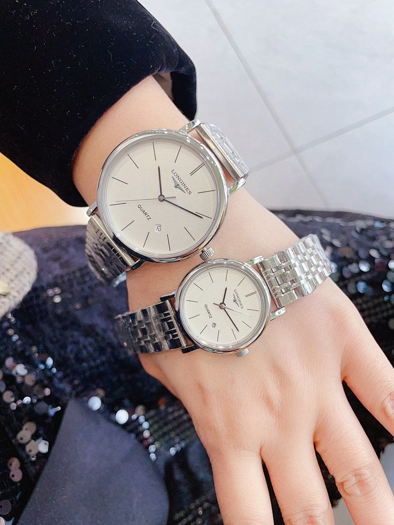 Longines quartz watch with silver link bracelet and white dial, round case