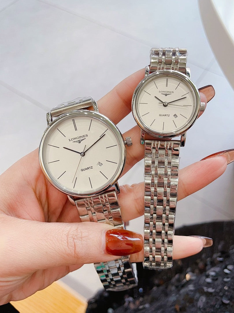Longines quartz watches with white dials and silver link bracelets, round rose-gold cases