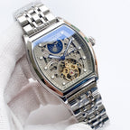 Longines watch with stainless steel bracelet and blue skeleton dial, gold-toned gears.
