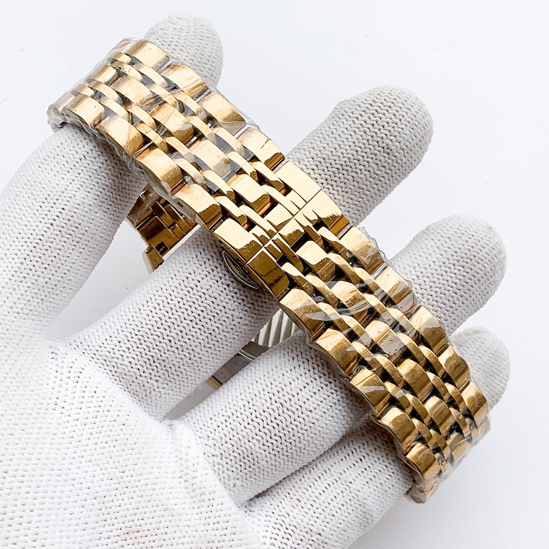 Longines watch with gold-tone linked bracelet, close-up of strap and case side.