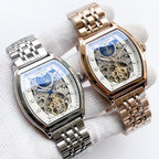 Longines watch pair with stainless steel and gold-tone bracelets, blue skeleton dials.