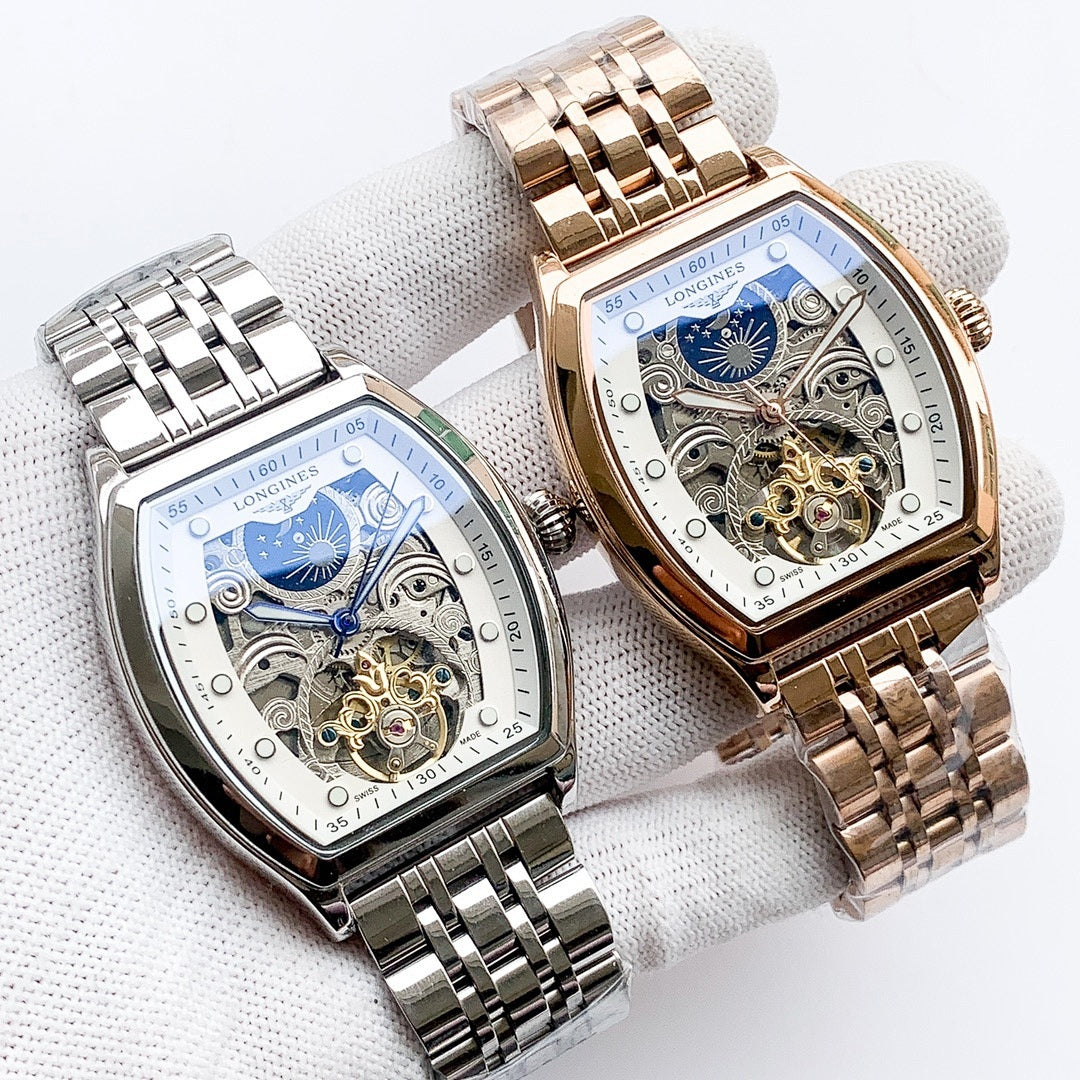 Longines watch pair with stainless steel and gold-tone bracelets, blue skeleton dials.