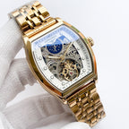 Longines watch with gold-tone bracelet and blue skeleton dial, ornate gear detail.