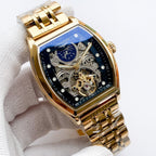 Longines watch with gold-tone bracelet and blue dial with skeleton movement and gold gears.