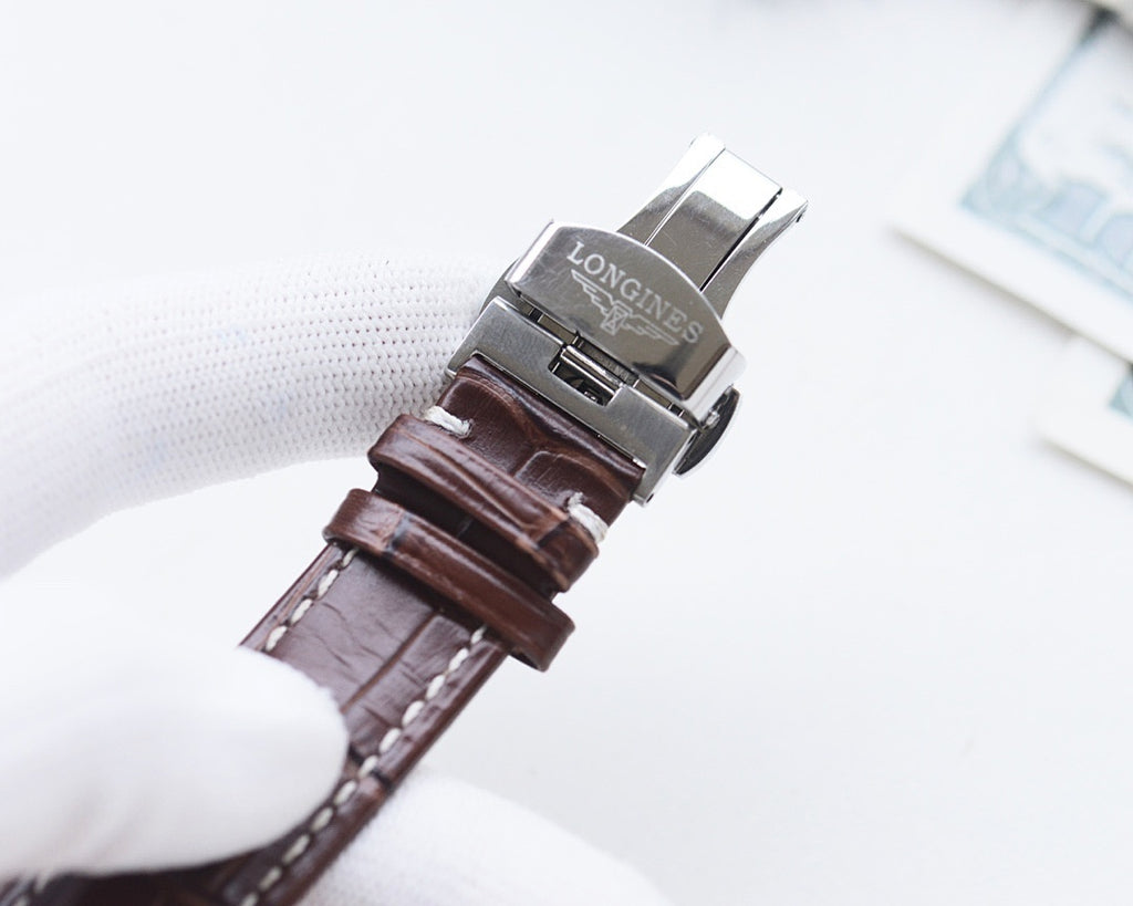Longines watch with brown leather strap and metal clasp, side view