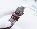 Longines watch with brown leather strap and metal clasp, side view